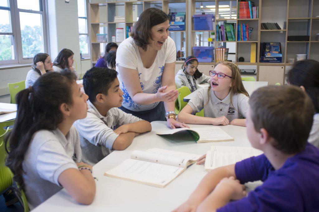 Students working with teacher