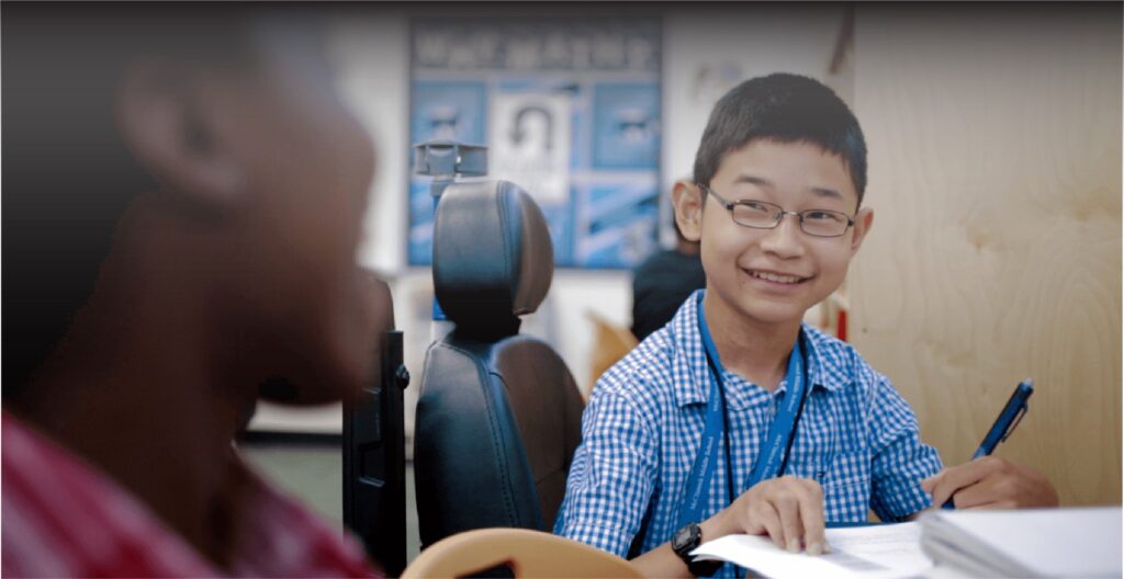 Student working with teacher